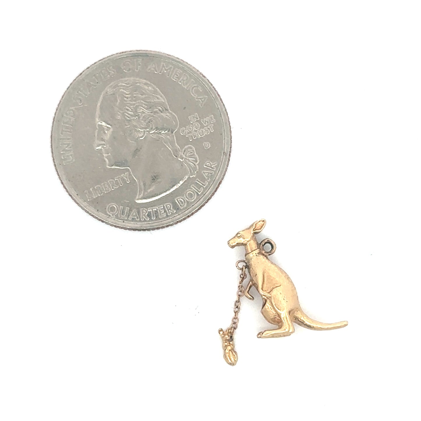 14k yellow gold kangaroo pendant with a joey charm, vintage silver lady jewelry, detailed close-up of the gold pendant.