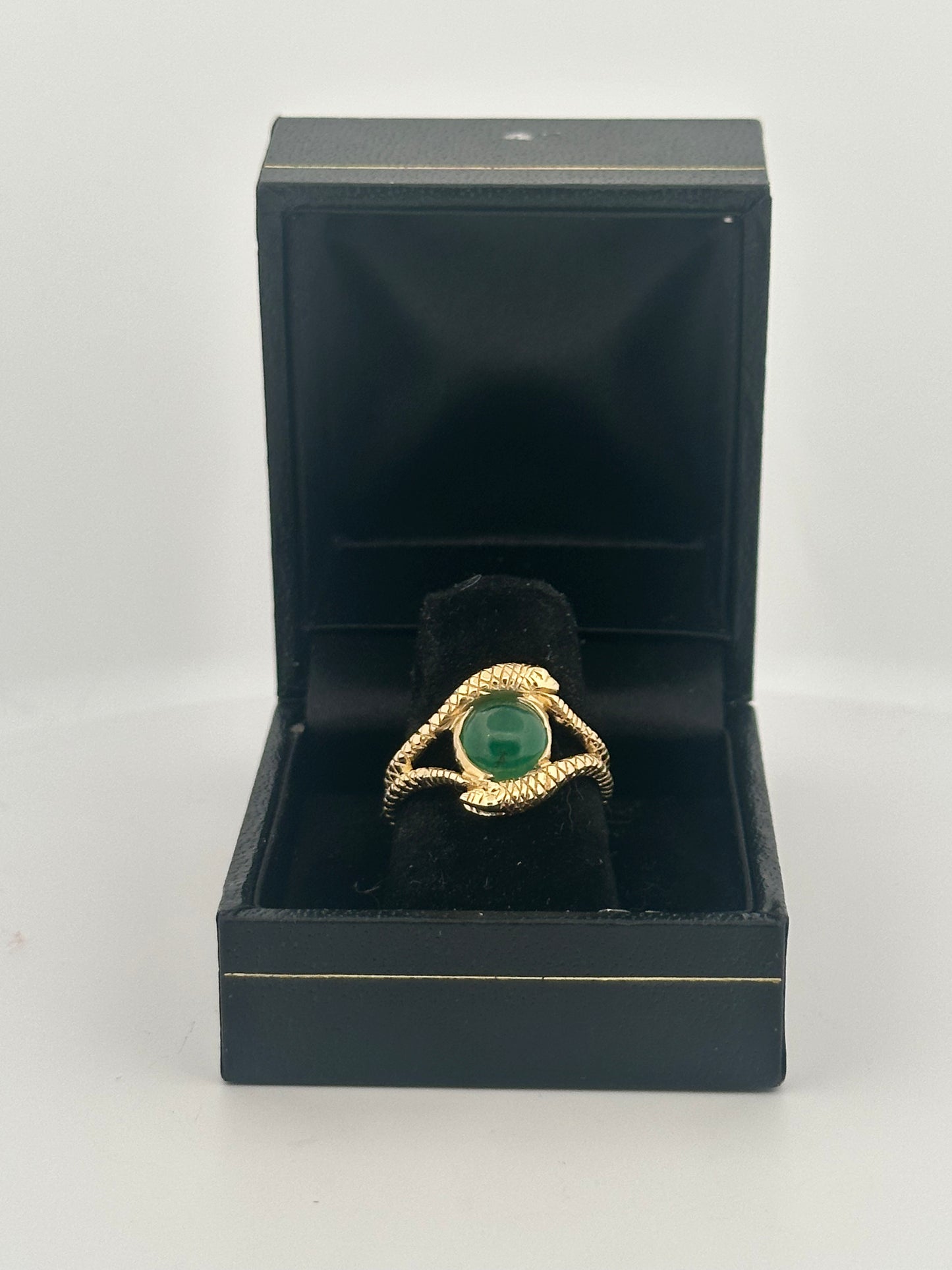 Double snake ring with natural emerald cabochon in 10k yellow gold