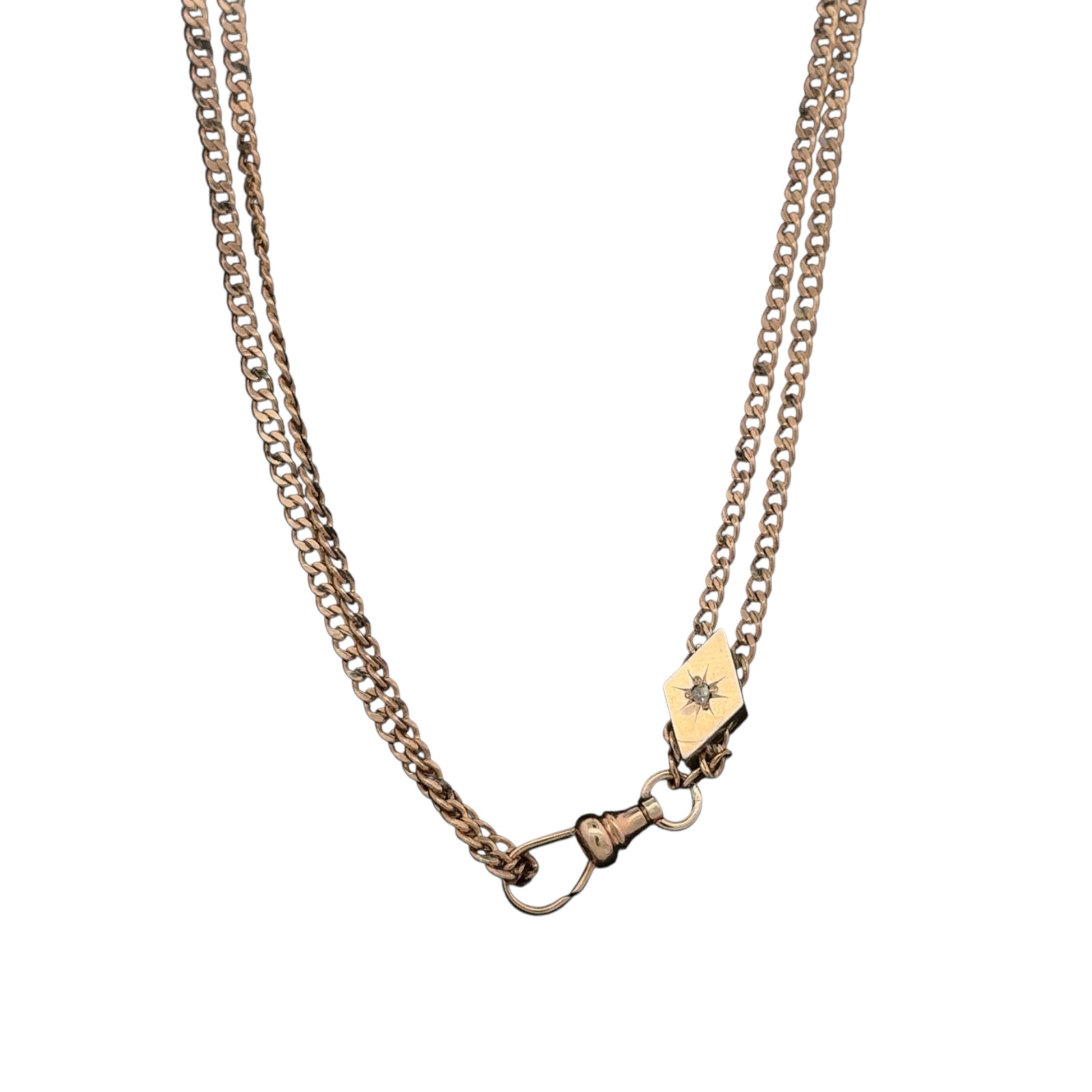 Antique Victorian watch chain with rose cut diamond slider in 10k gold, vintage Silver Lady piece with intricate design and craftsmanship.