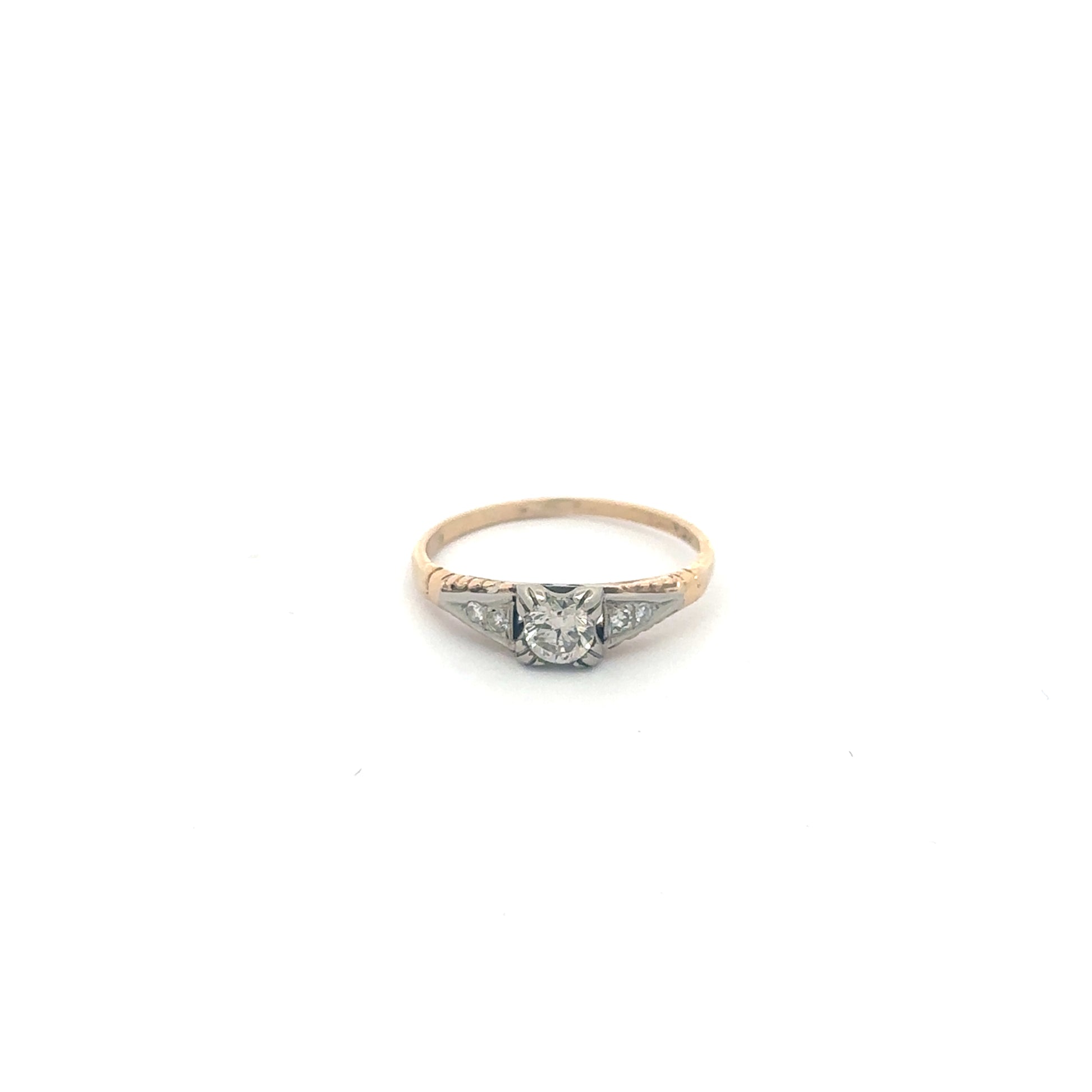 Two-tone yellow gold diamond engagement ring from Silver Lady Vintage featuring a sparkling central diamond and intricate band details.