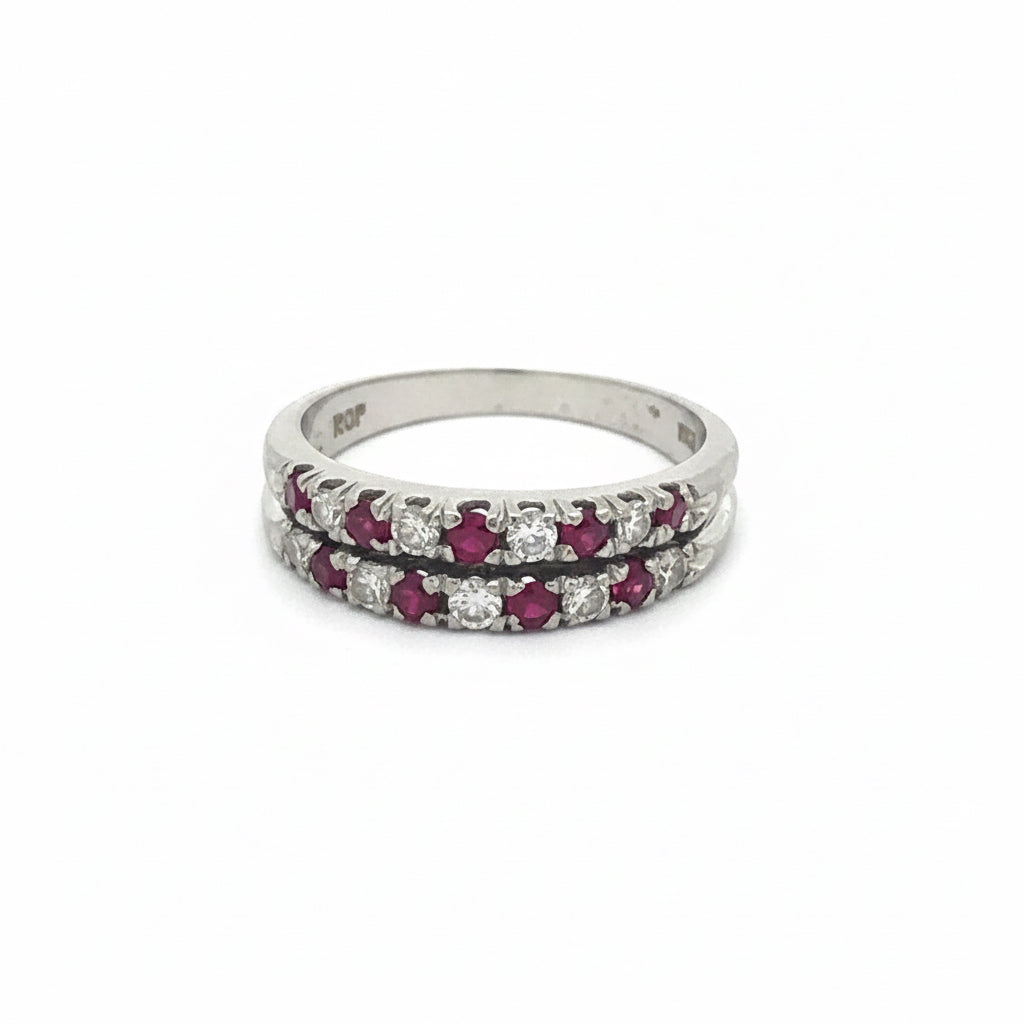 Ruby and diamond double row stacker ring in 18k white gold with sparkling gemstones and intricate design.
