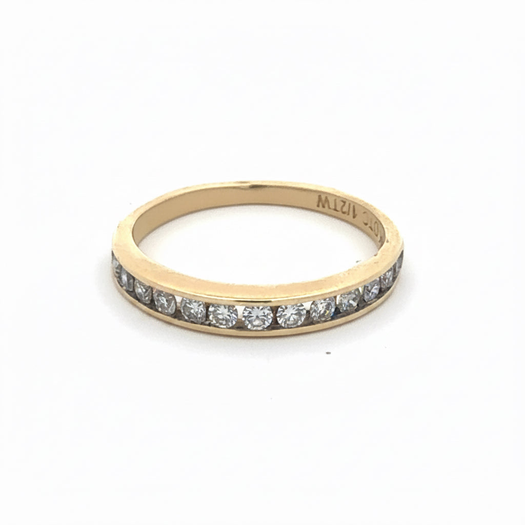 Channel set diamond band in 10k yellow gold, featuring a row of sparkling diamonds on a vintage Silver Lady design ring.