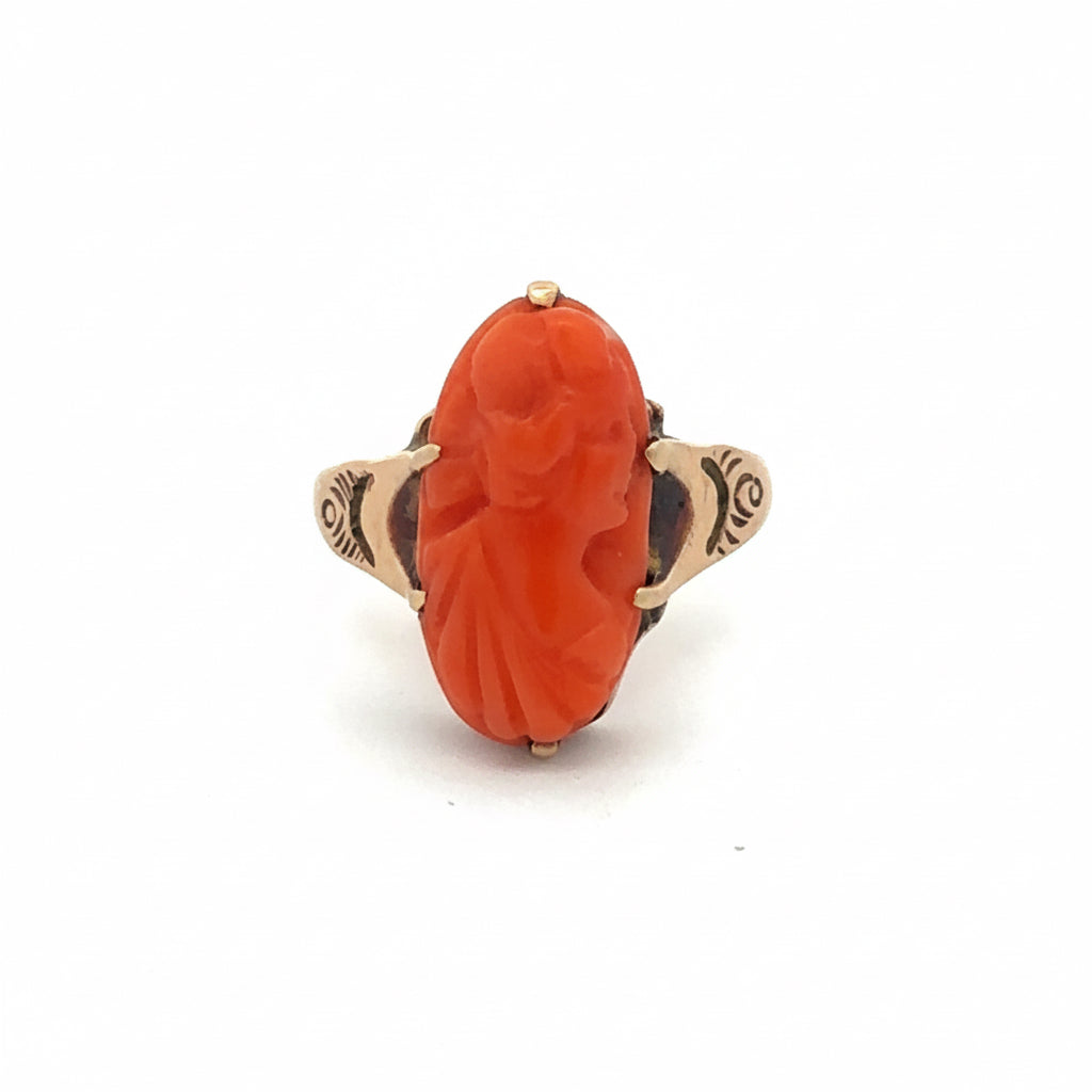 Antique hand-carved coral cameo ring in 10k yellow gold, vintage Silver Lady design, detailed carved profile on a gold band.