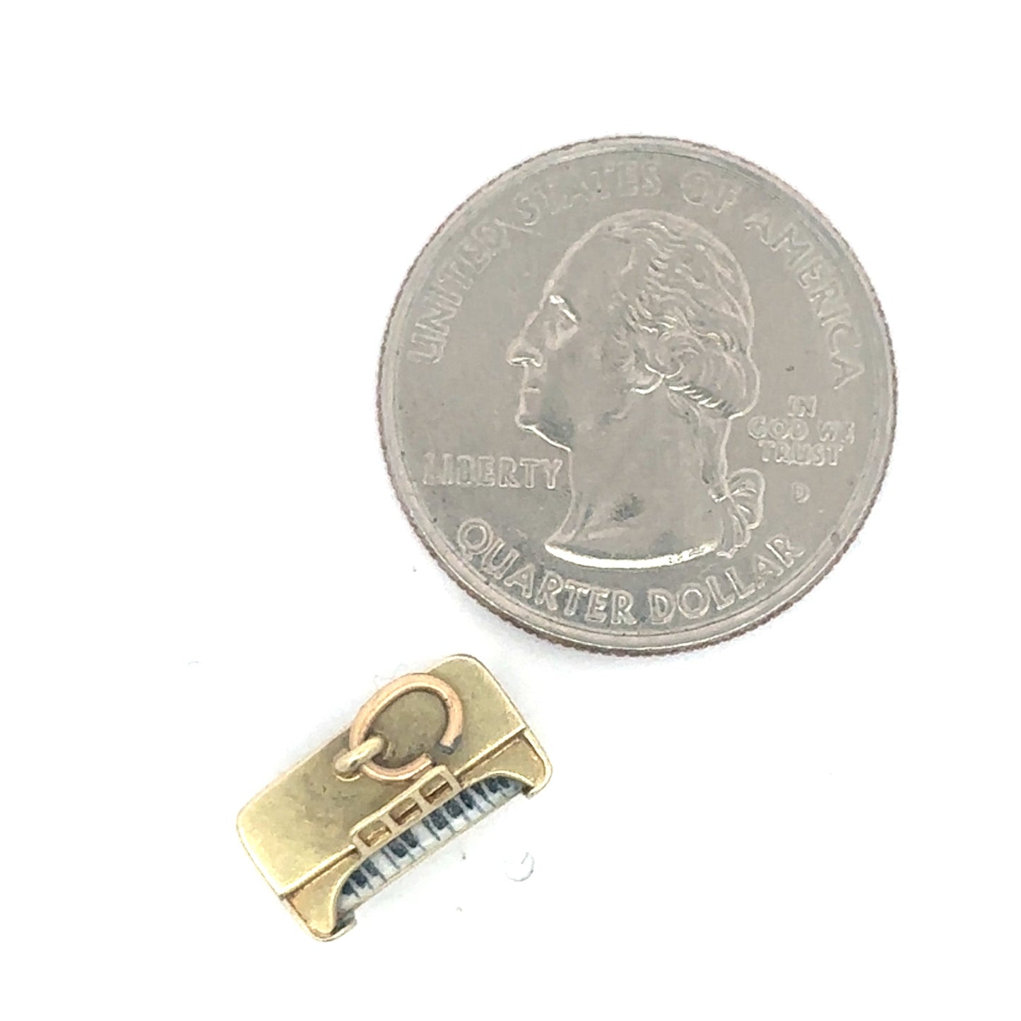 Vintage upright piano pendant charm in 14k yellow gold with detailed musical instrument design.