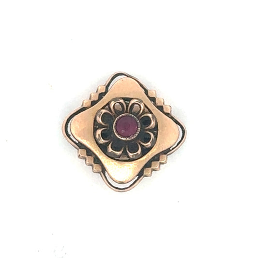 Antique Victorian ruby slider pendant in 10K rose gold with intricate vintage design, displayed on a white background.