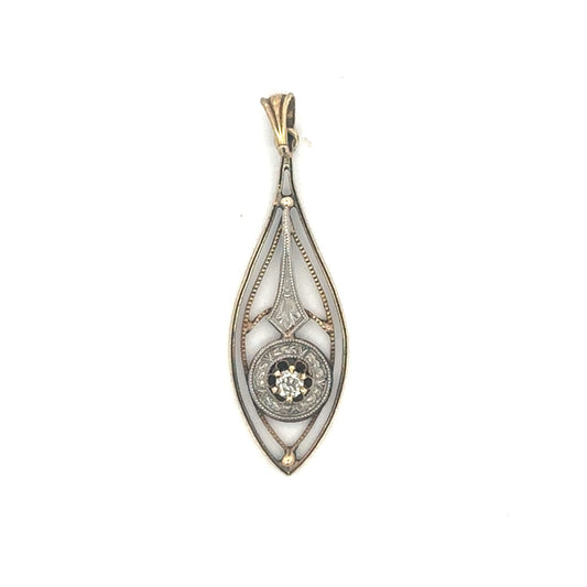 Antique Victorian diamond lavalier pendant in 14k white and yellow gold, featuring intricate vintage design and sparkling diamonds.