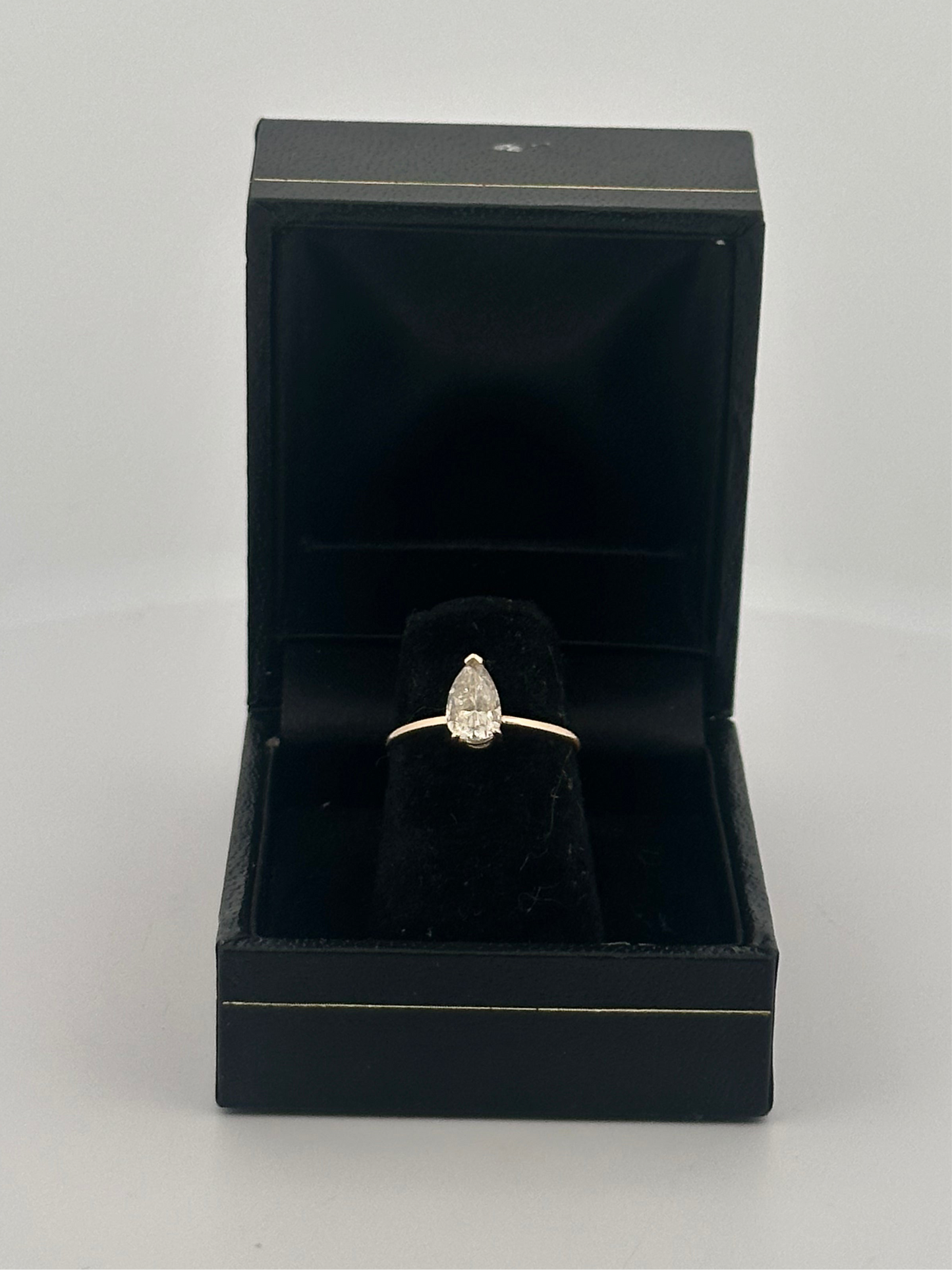 Vintage natural pear shaped diamond solitaire ring in 14k yellow gold