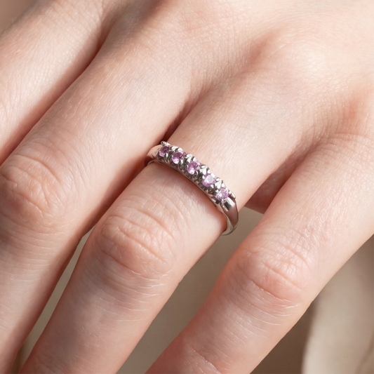 Vintage 18k pink sapphire stacker ring by Silver Lady Vintage, featuring a delicate band with pink sapphire accents.