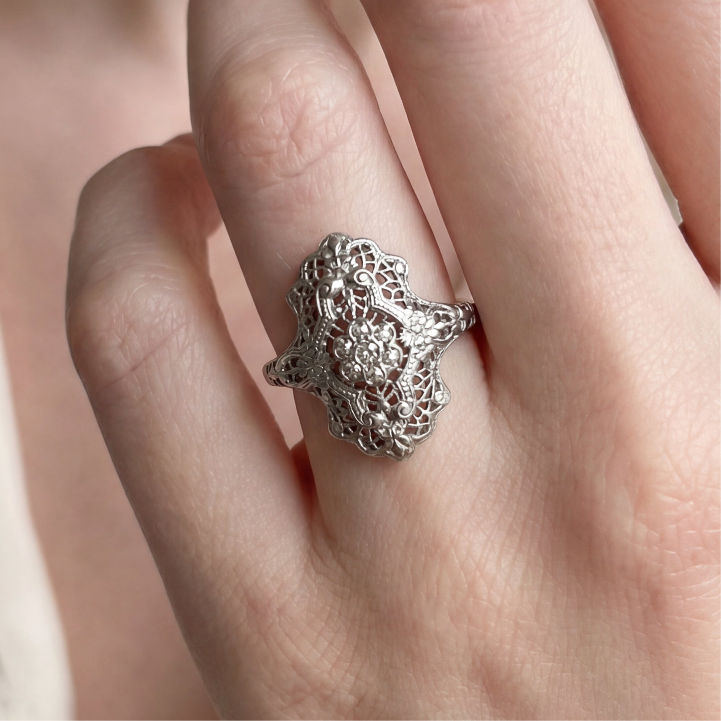 Antique art deco diamond shield ring in 18k white gold