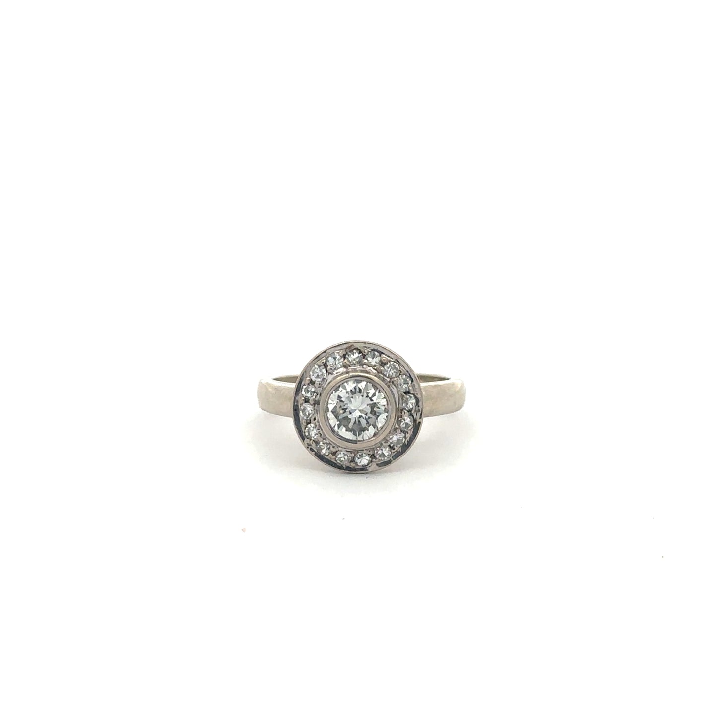 Vintage brilliant cut diamond halo ring in 14k white gold with intricate detailing, by Silver Lady Vintage.