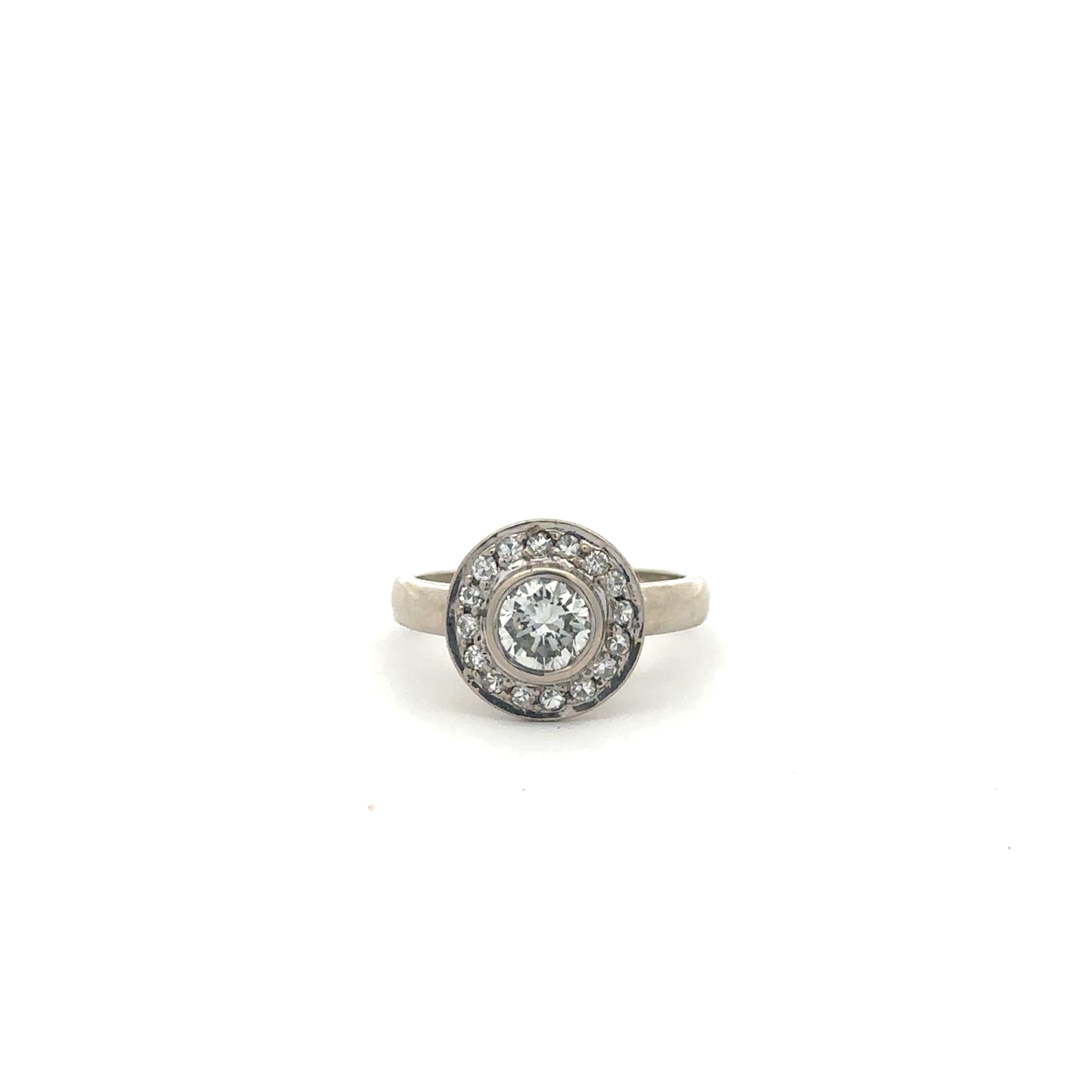 Vintage brilliant cut diamond halo ring in 14k white gold with intricate detailing, by Silver Lady Vintage.