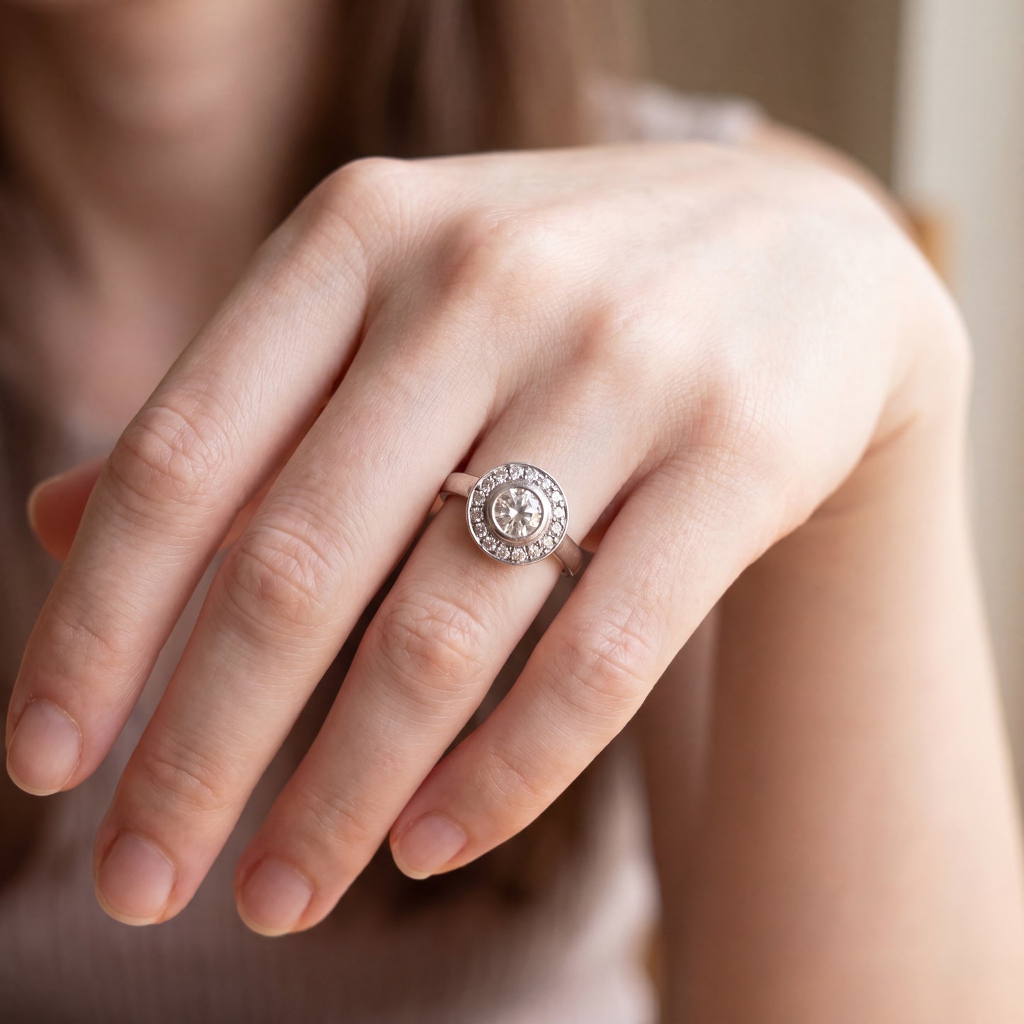 Vintage brilliant cut diamond halo ring in 14k white gold with intricate detailing, by Silver Lady Vintage.