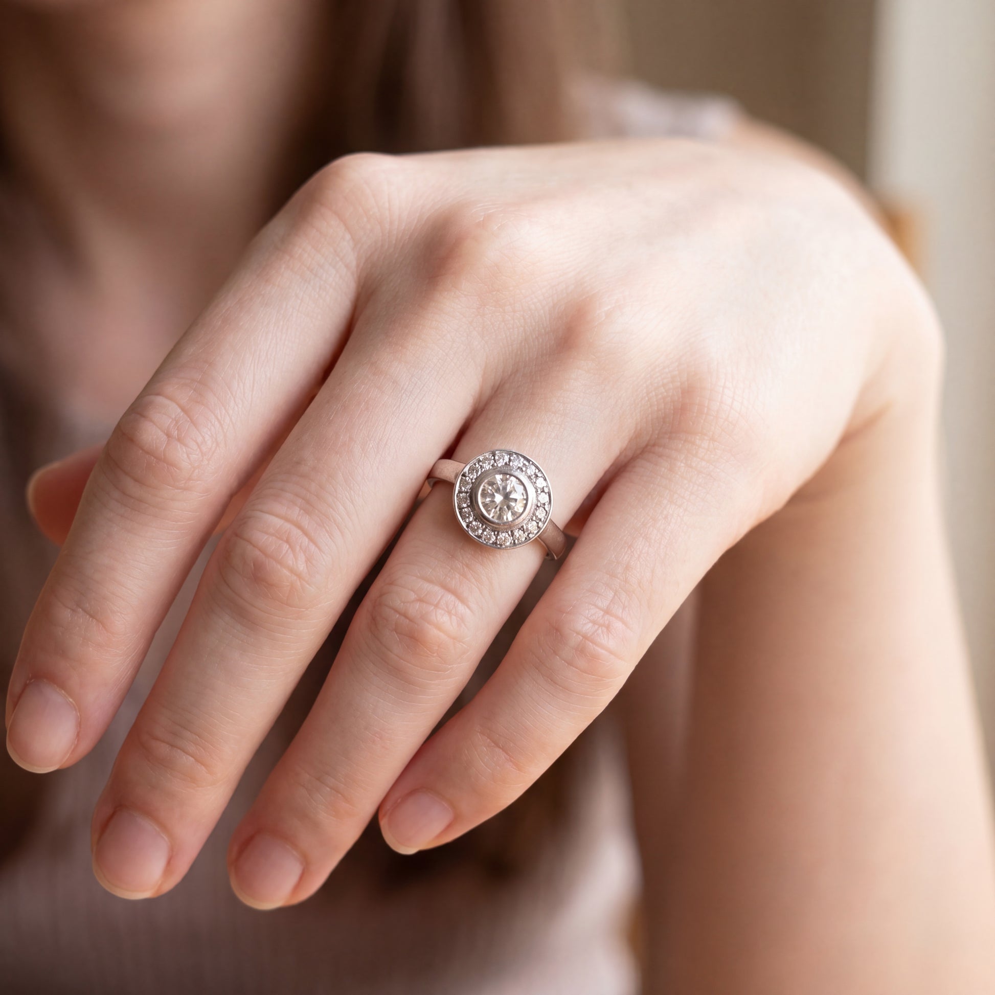 Vintage brilliant cut diamond halo ring in 14k white gold with intricate detailing, by Silver Lady Vintage.
