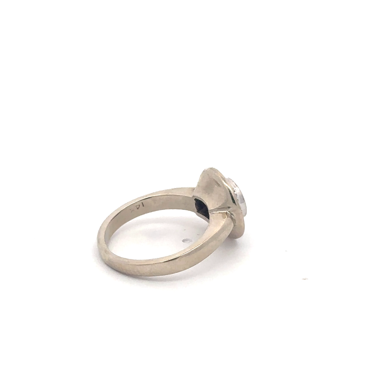 Vintage brilliant cut diamond halo ring in 14k white gold with intricate detailing, designed by Silver Lady Vintage.