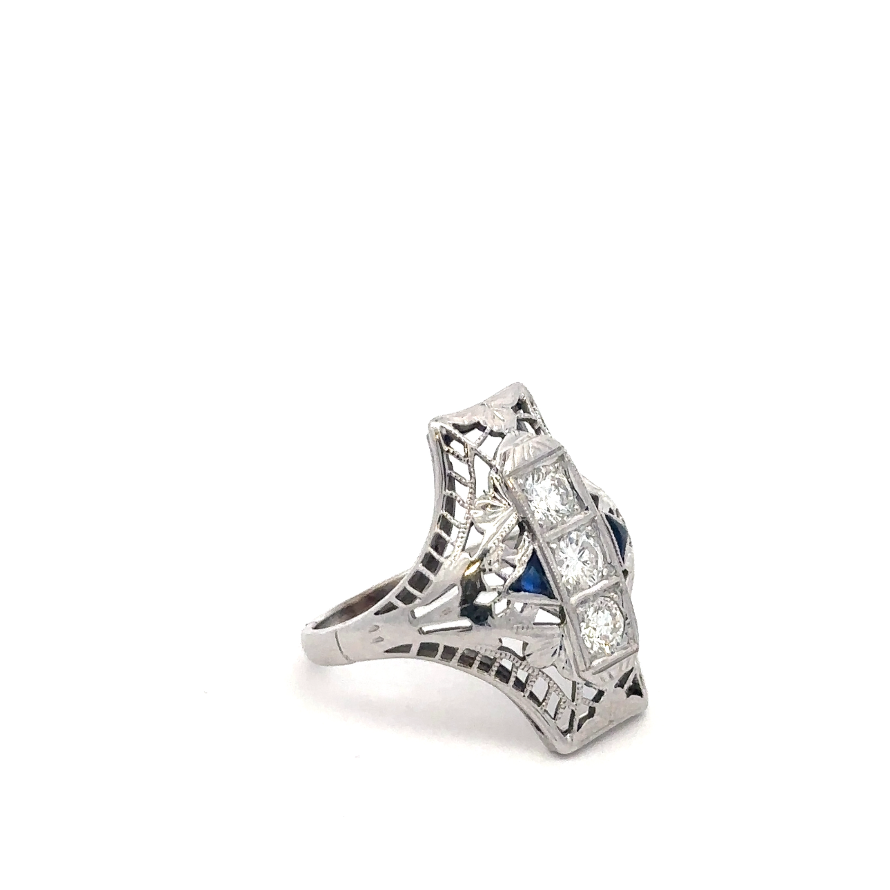 Art deco shield ring by Silver Lady Vintage featuring a sapphire and diamond set in 18k white gold.