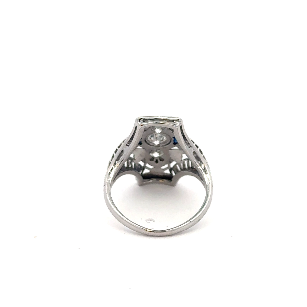 Art deco shield ring by Silver Lady Vintage featuring a sapphire and diamond set in 18k white gold.