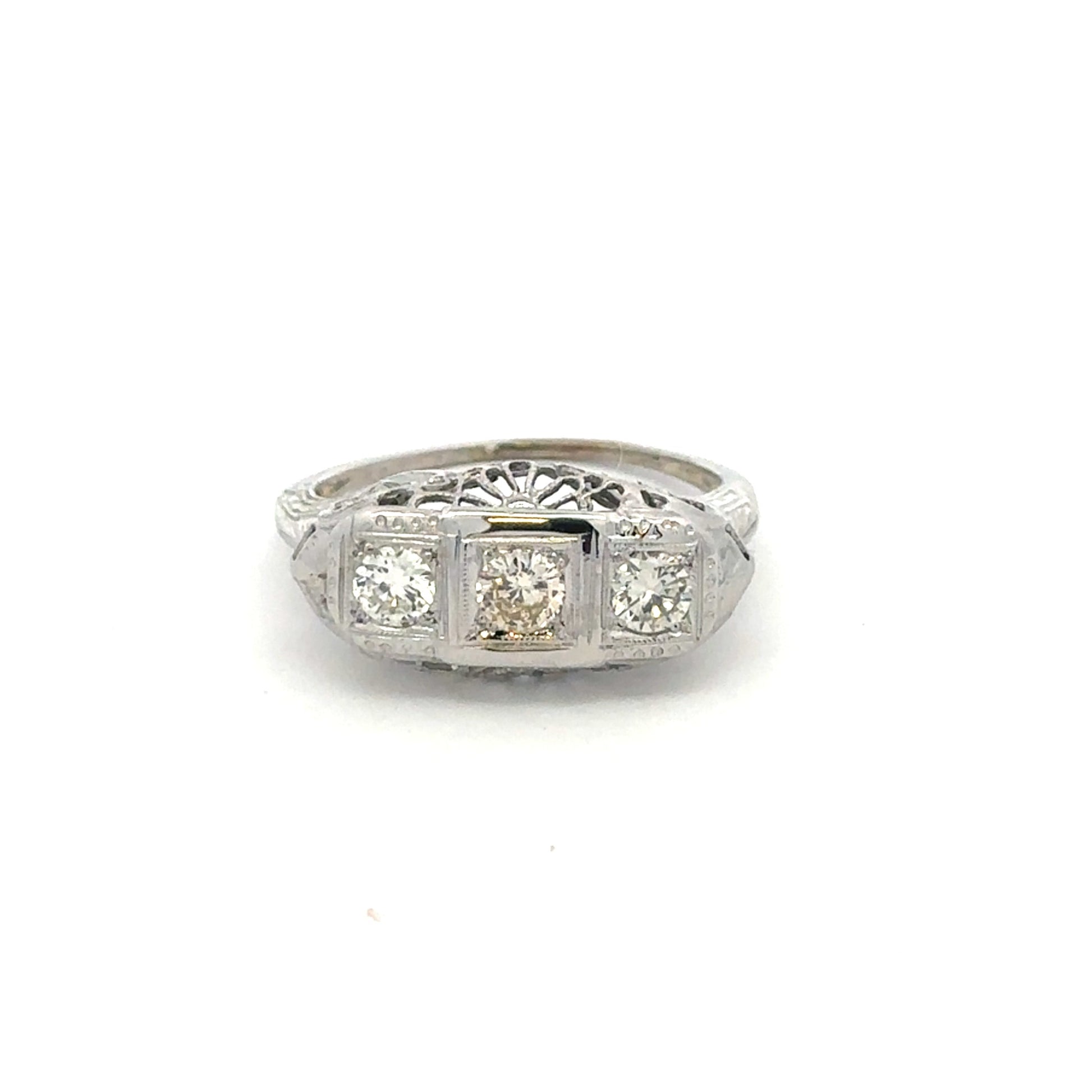 Art deco three-stone natural diamond ring in 18k white gold featuring vintage Silver Lady design and intricate detailing.