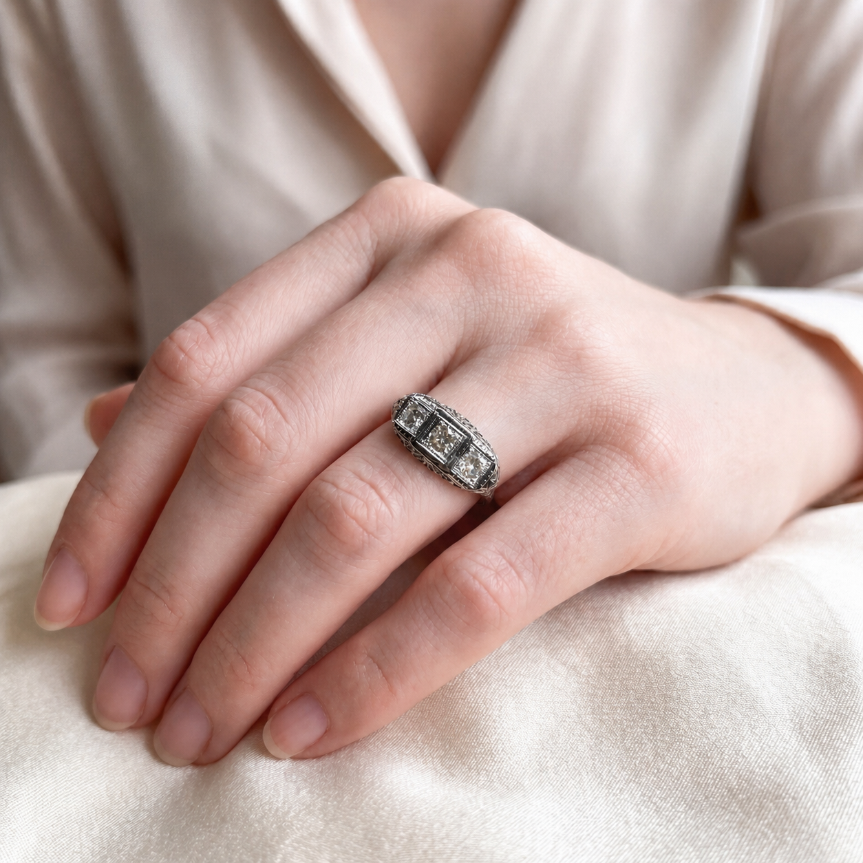 Art deco three-stone natural diamond ring in 18k white gold with intricate vintage design, by Silver Lady Vintage.