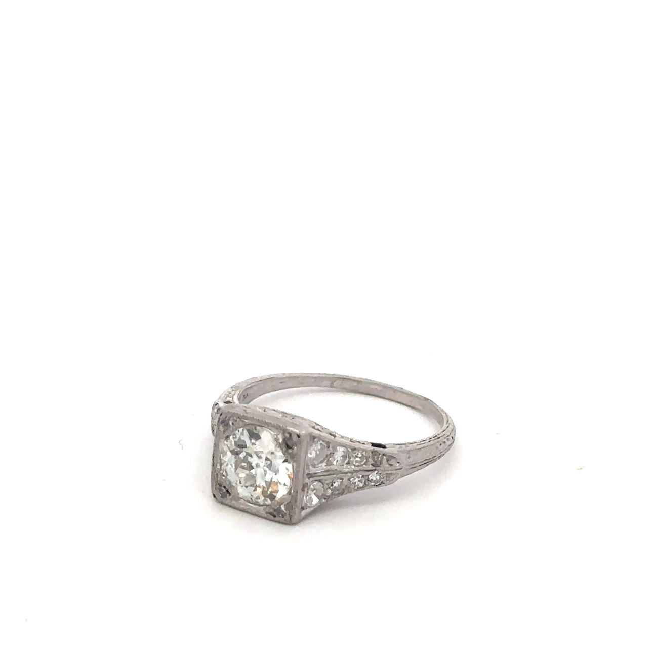 Art deco platinum ring with old mine cut diamond, vintage Silver Lady design featuring geometric details and elegance.