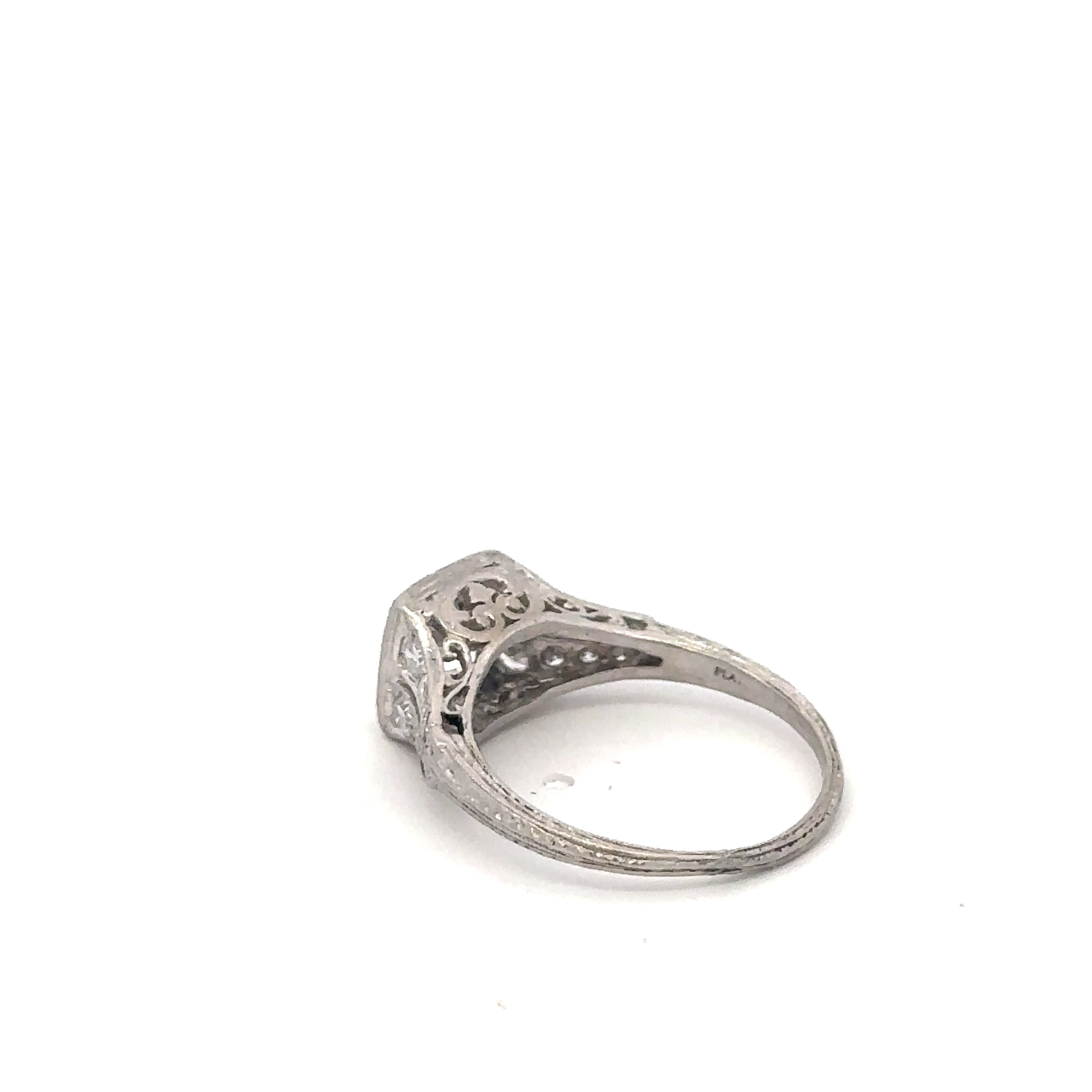 Silver Lady Vintage art deco platinum ring featuring an old mine cut diamond with intricate geometric design.