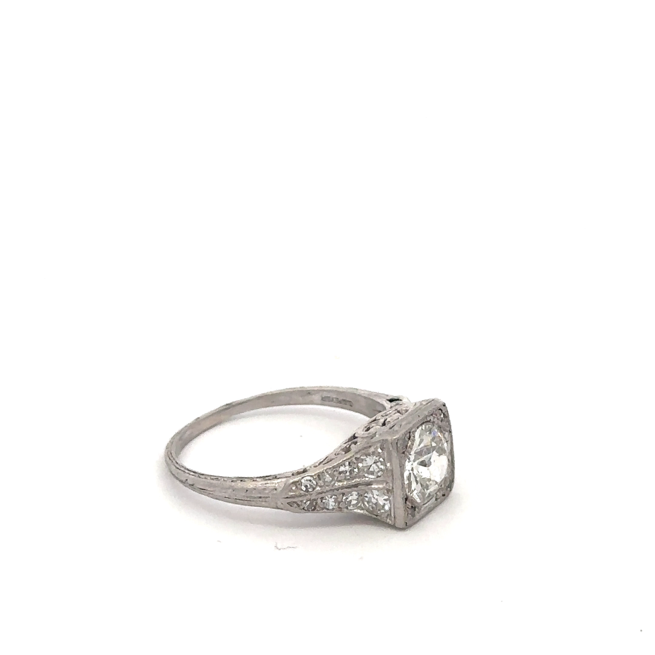 Silver Lady Vintage art deco platinum ring featuring an old mine cut diamond with intricate geometric detailing.