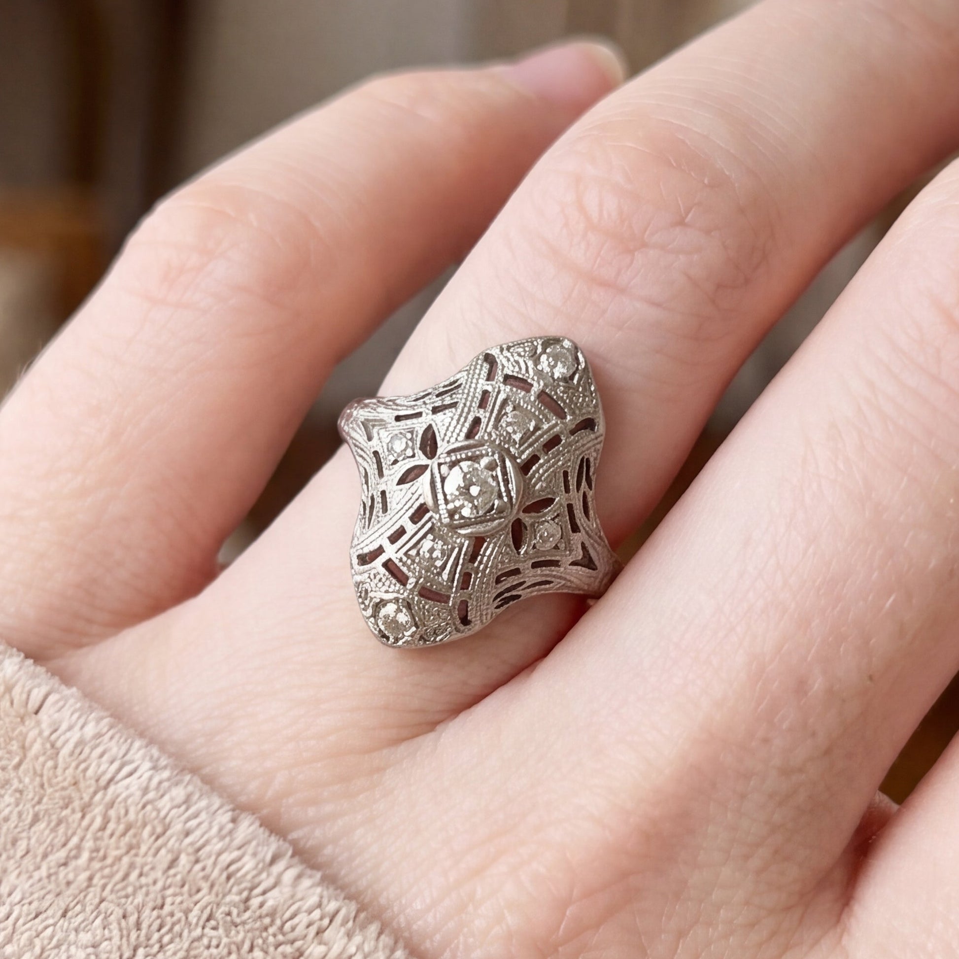 Art deco diamond shield ring in 18k white gold featuring geometric design and sparkling diamonds, from Silver Lady Vintage.