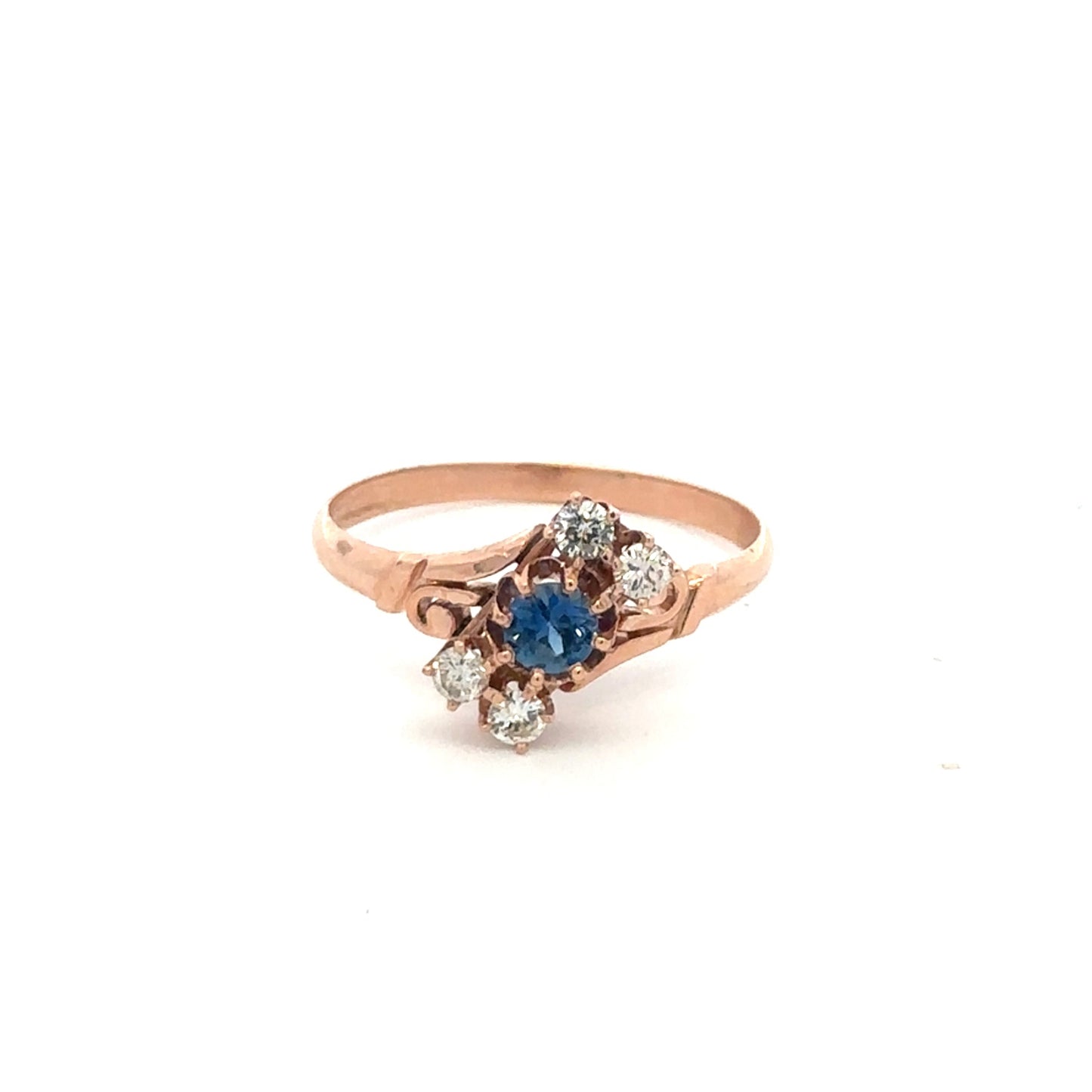 Antique Victorian Ceylon sapphire and diamond ring in 14k rose gold, featuring intricate vintage design and gemstone details.