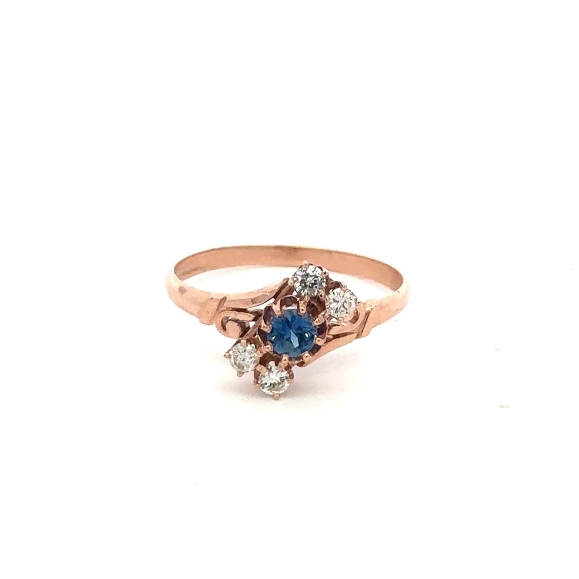 Antique Victorian Ceylon sapphire and diamond ring in 14k rose gold, featuring intricate vintage design and gemstone details.