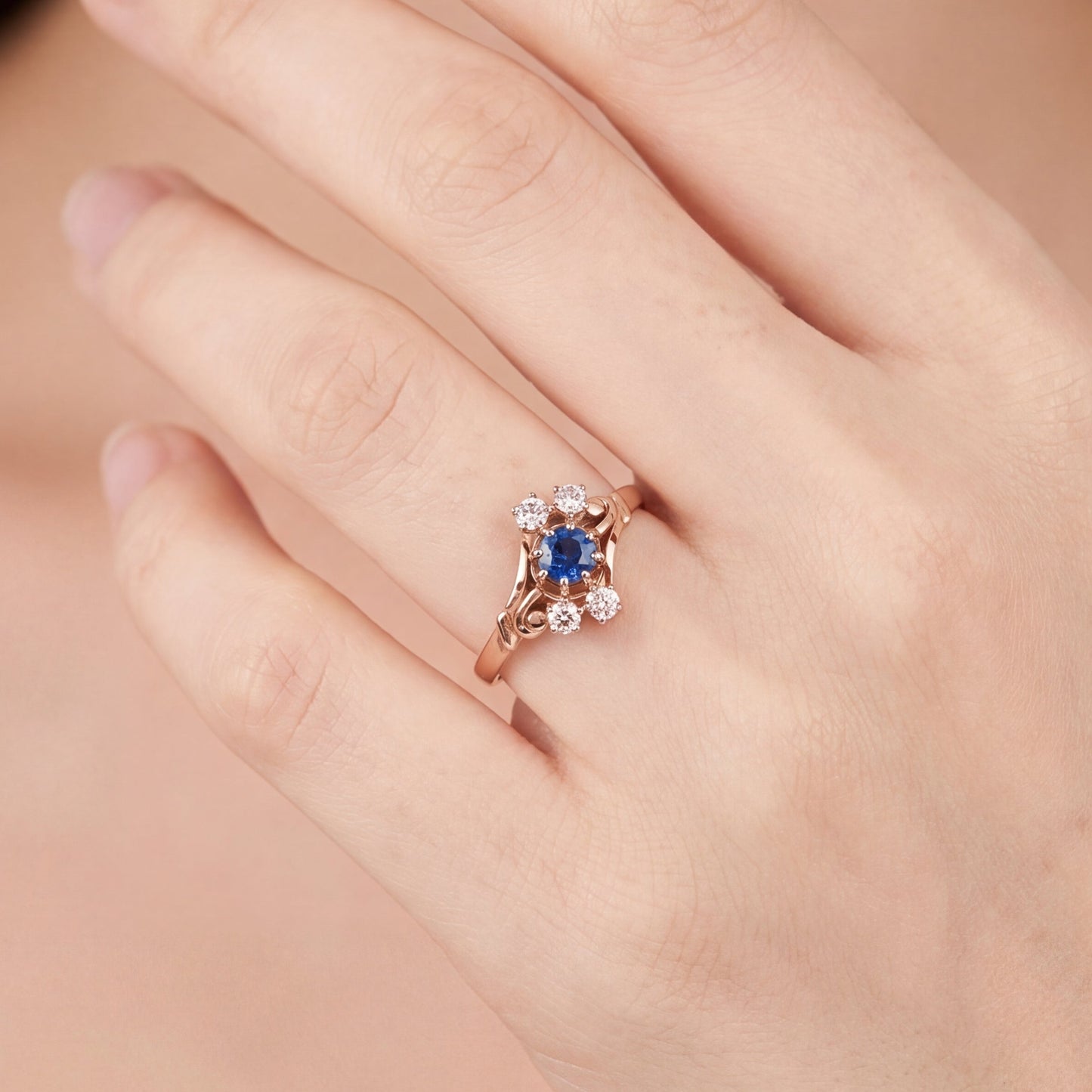 Antique Victorian Ceylon sapphire and diamond ring in 14k rose gold, featuring intricate vintage design and craftsmanship.