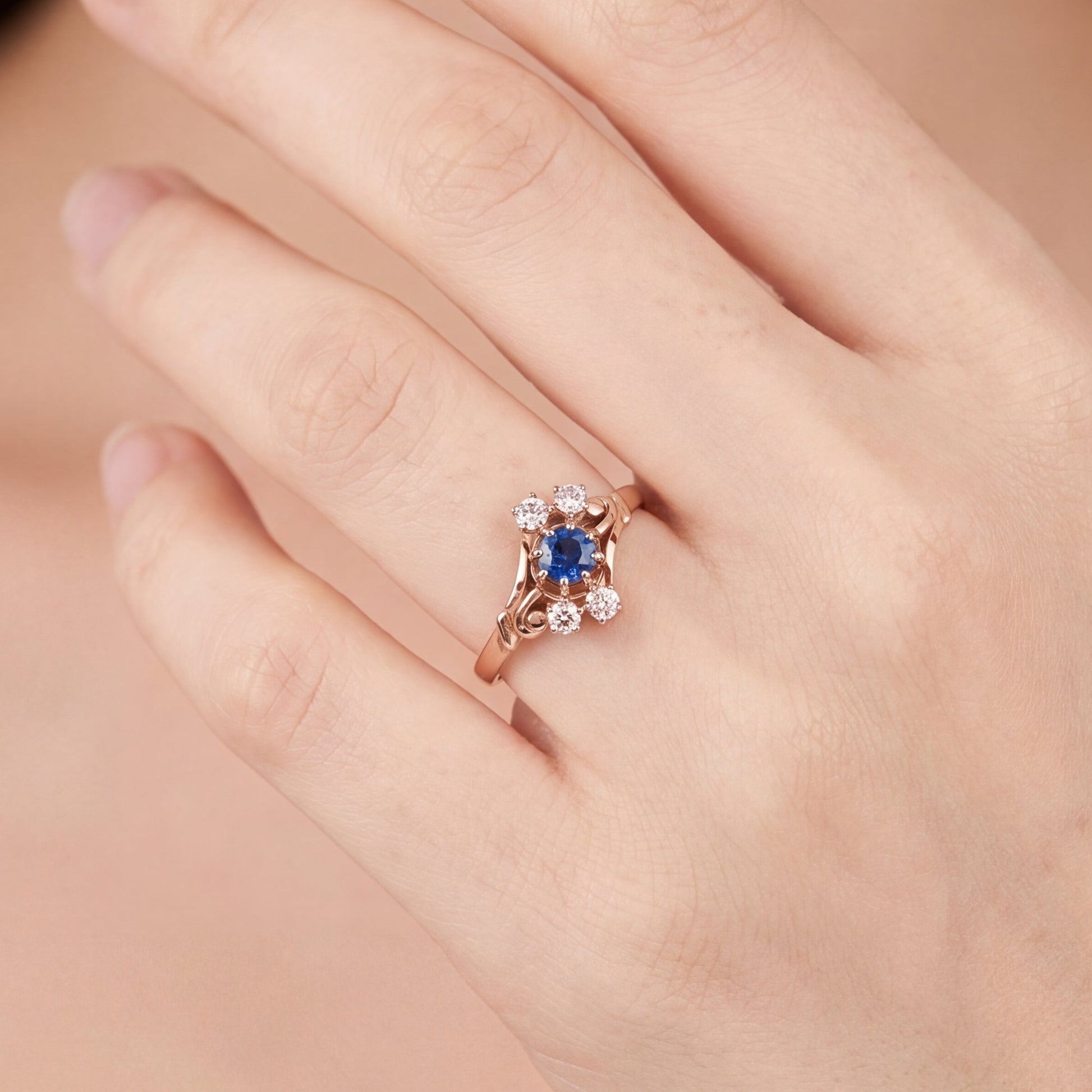 Antique Victorian Ceylon sapphire and diamond ring in 14k rose gold, featuring intricate vintage design and craftsmanship.