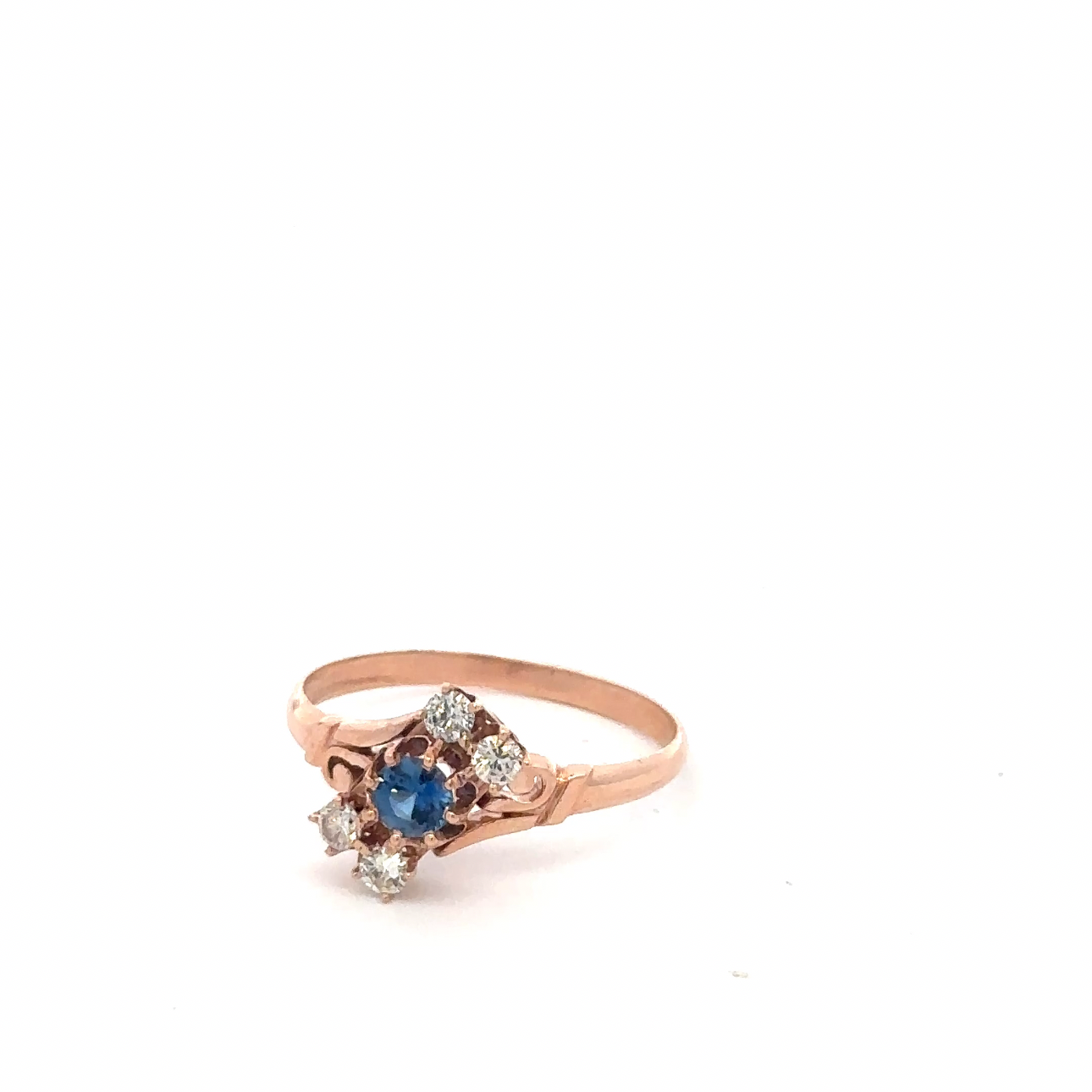 Antique Victorian Ceylon sapphire and diamond ring in 14k rose gold, featuring intricate vintage design and sparkling gemstones.