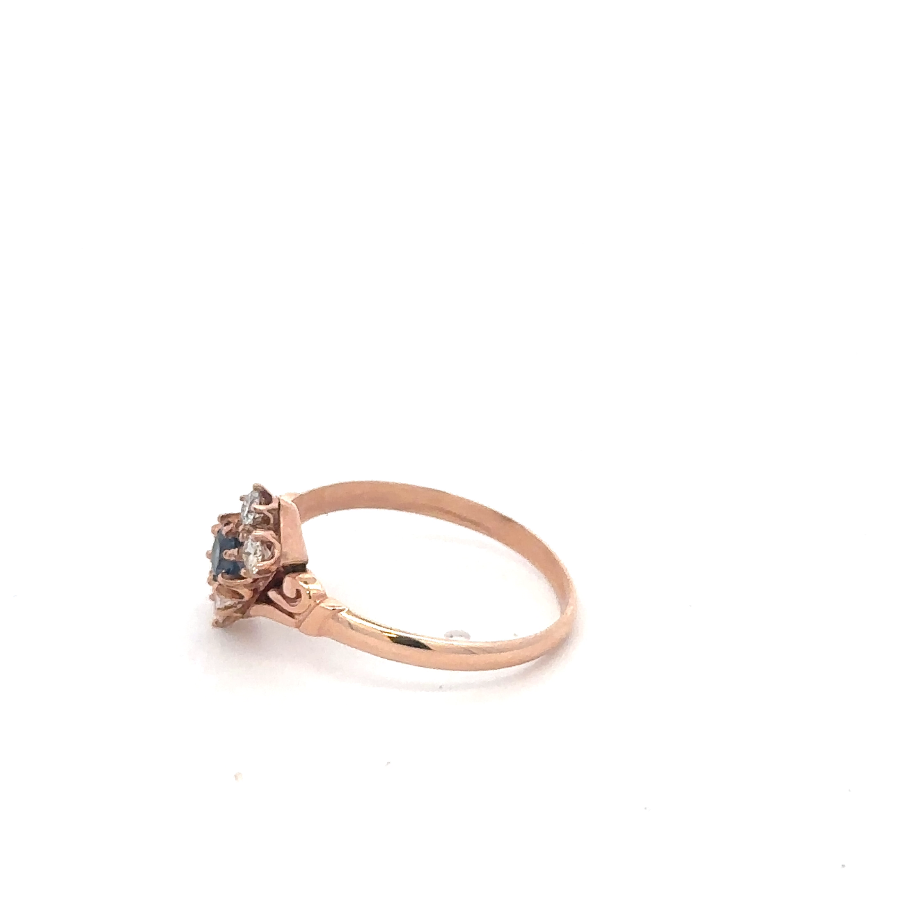 Antique Victorian Ceylon sapphire and diamond ring in 14k rose gold with intricate vintage detailing.