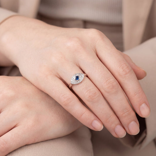 Vintage sapphire cabochon and diamond evil eye ring in 14k white gold by Silver Lady Vintage, showcasing intricate design and jewelry craftsmanship.