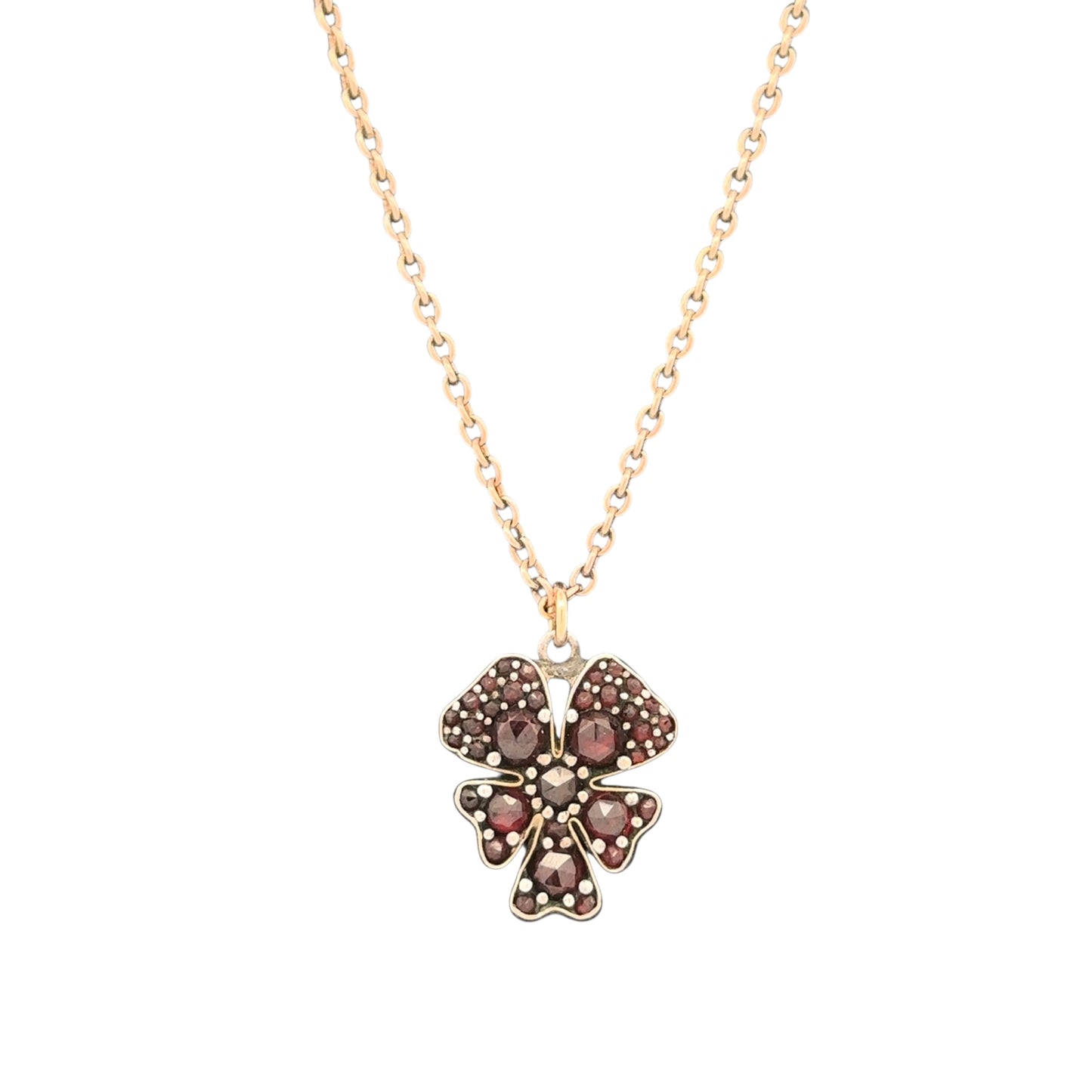 Antique Victorian garnet pansy pendant necklace in 9k yellow gold, featuring intricate floral design and vintage craftsmanship.
