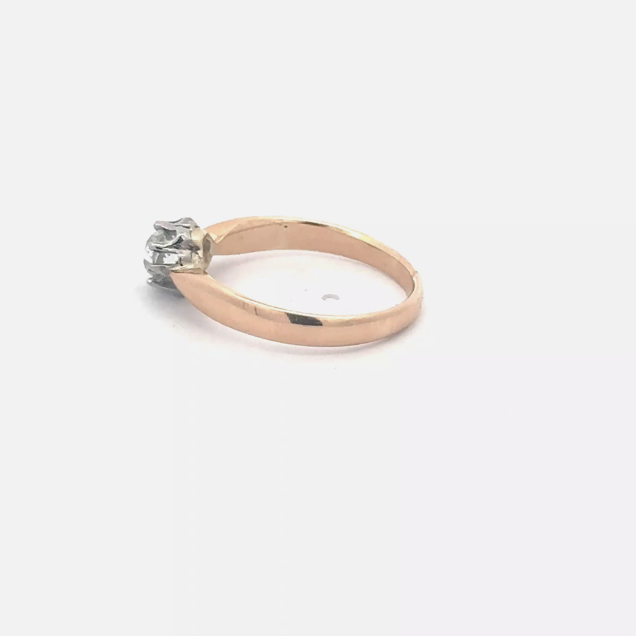 Antique Victorian diamond solitaire ring in 14k yellow gold with tapered band, featuring old mine cut diamond and intricate vintage design