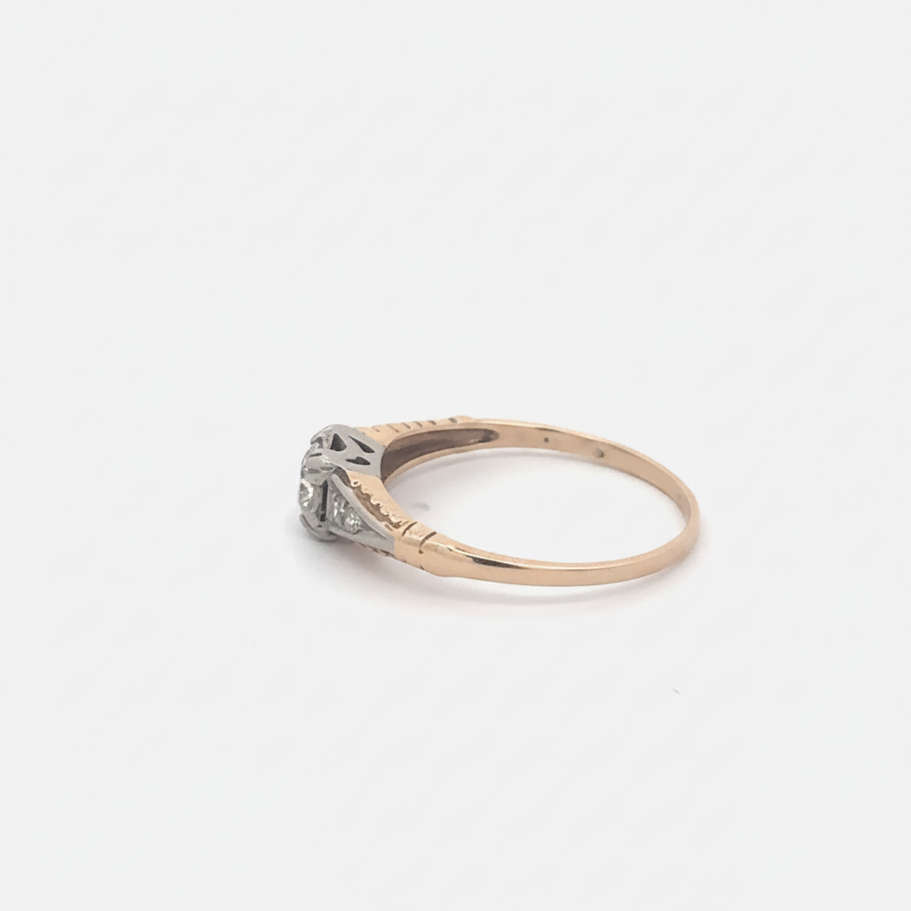 Two-tone diamond engagement ring in yellow gold featuring a silver lady vintage design with sparkling diamonds on a sleek band.