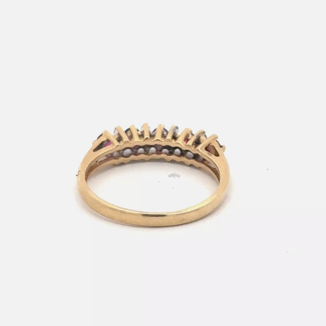 Natural ruby and diamond stacker band in 14k yellow gold, showcasing elegant gemstone accents and fine craftsmanship.