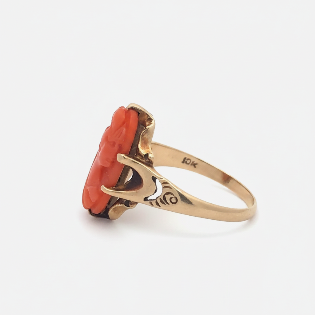 Antique hand-carved coral cameo ring in 10k yellow gold, featuring detailed vintage design and intricate craftsmanship.