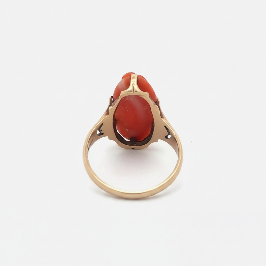 Antique hand-carved coral cameo ring in 10k yellow gold, vintage jewelry with intricate floral design and detailed craftsmanship.