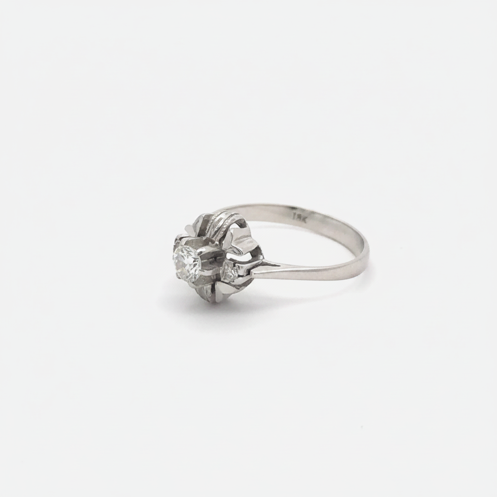 Art Deco floral motif diamond ring in 18k white gold with intricate silver detailing, designed by Silver Lady Vintage.