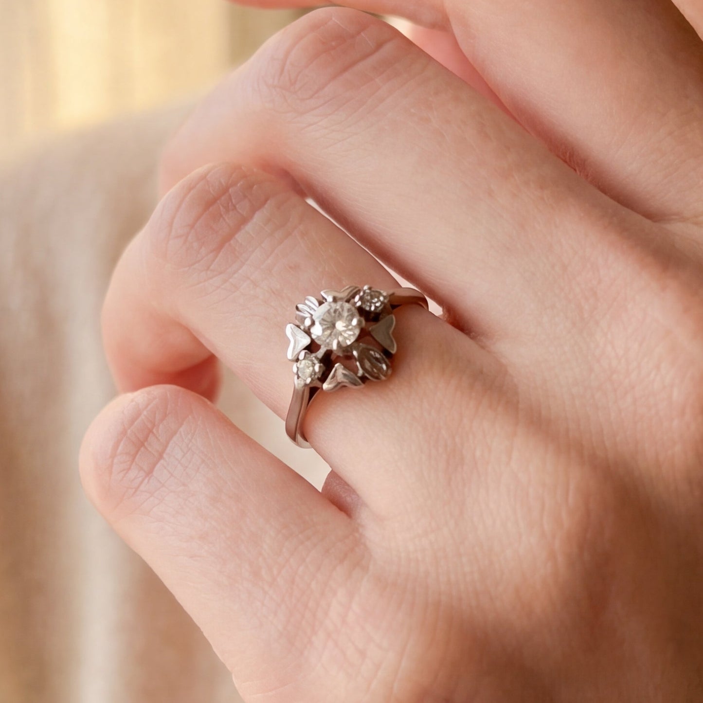 Art Deco floral motif diamond ring in 18k white gold, Silver Lady Vintage jewelry with intricate design and sparkling diamonds.