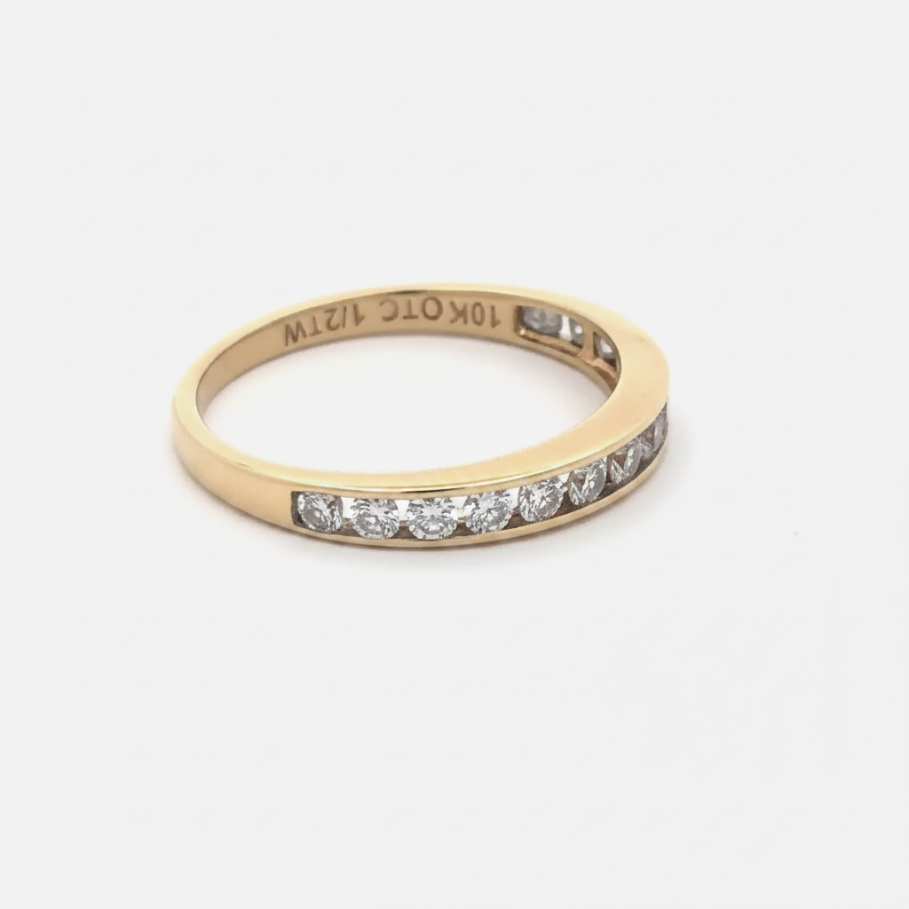 Channel set diamond band in 10k yellow gold, featuring sparkling diamonds in a sleek, elegant design from Silver Lady Vintage.