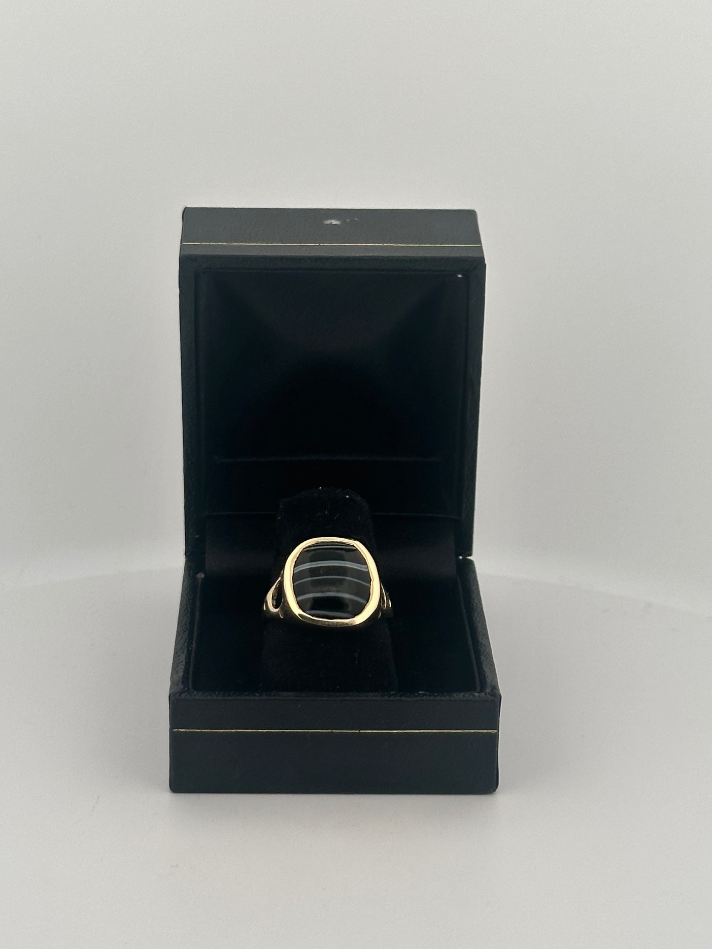 Black banded agate bezel set ring in 10k yellow gold