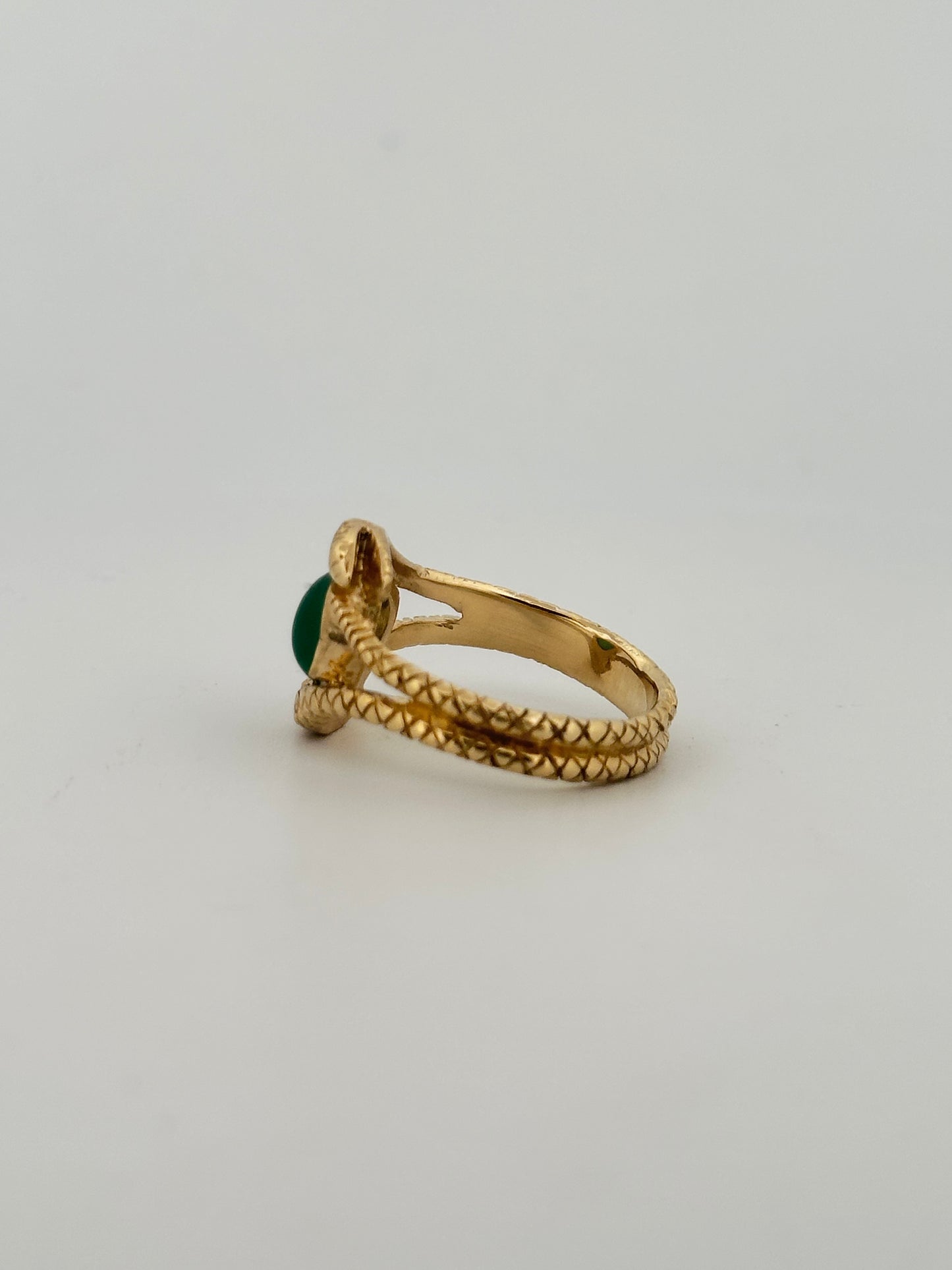 Double snake ring with natural emerald cabochon in 10k yellow gold