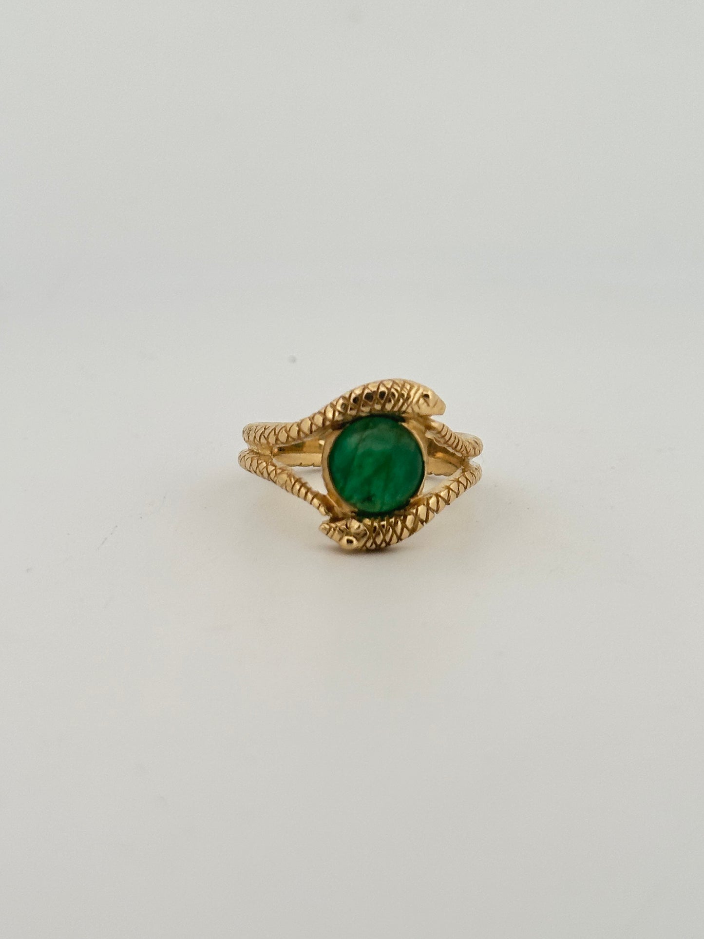 Double snake ring with natural emerald cabochon in 10k yellow gold